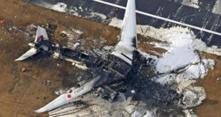 An aerial view shows burnt Japan Airlines' Airbus A350 plane after a collision with a Japan Coast Guard aircraft at Haneda International Airport in Tokyo, Japan January 3, 2024. LivemintUSA